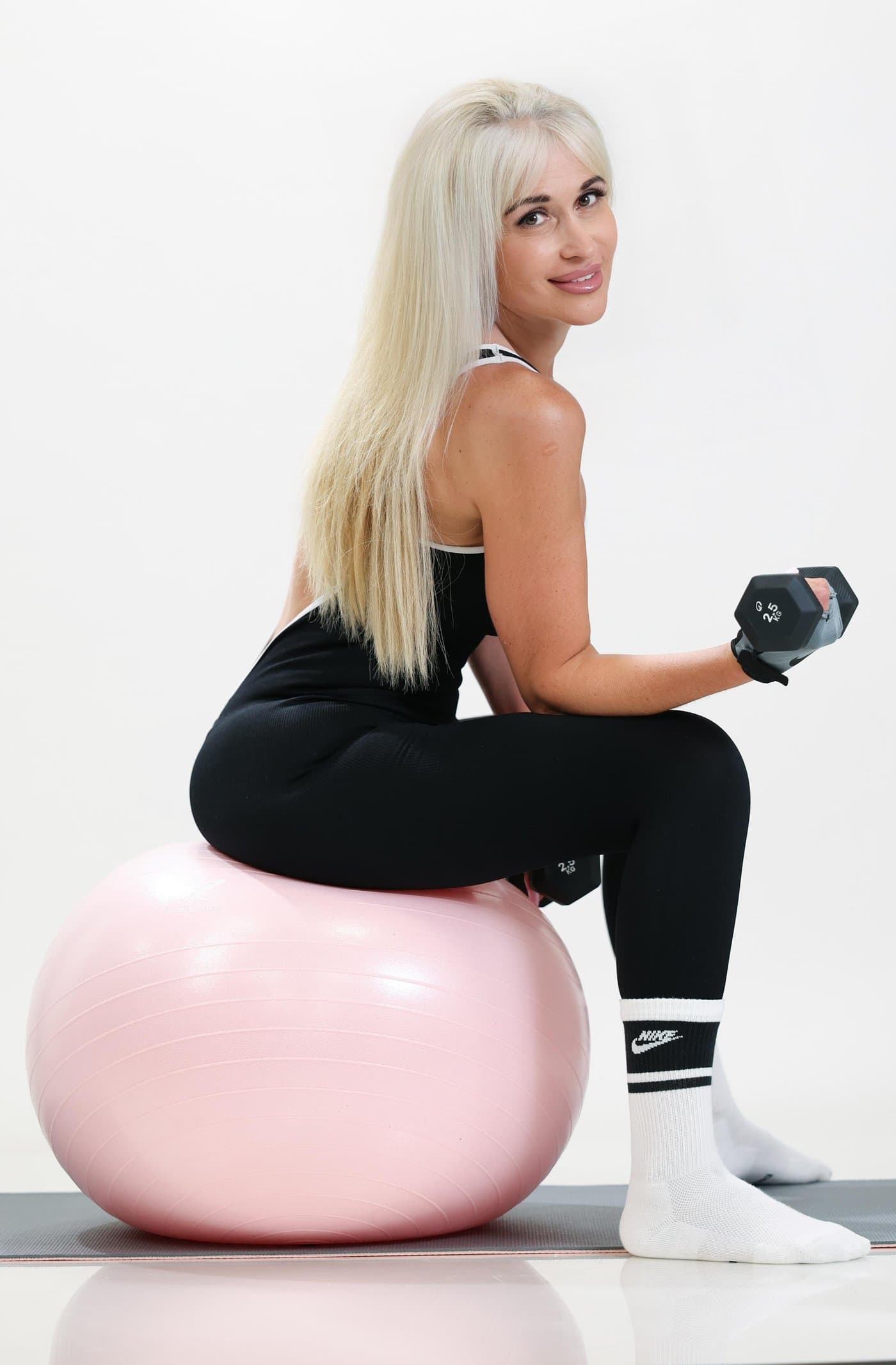 Strong, focused, unstoppable — you. My Better You - LIFE workout with a dumbbell and a balance ball.